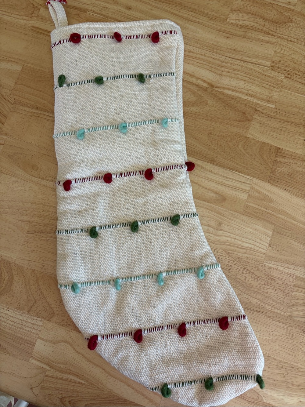Woven Holiday Stocking with Red, Green and Aqua Pom Trim